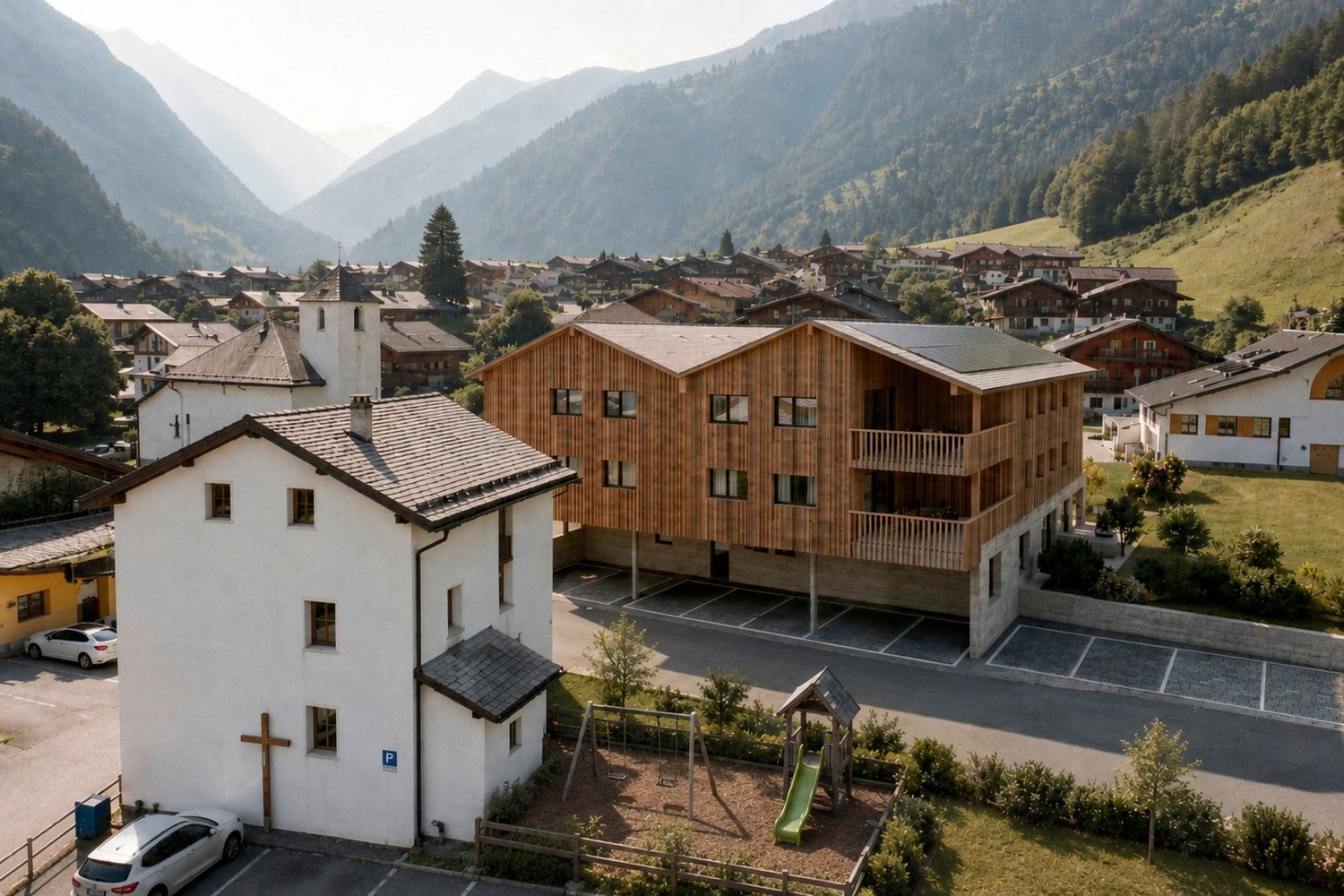 Visuel d'architecte du centre de Prarreyer : la chapelle blanche au premier plan, la place de jeux et la résidence juste derrière.